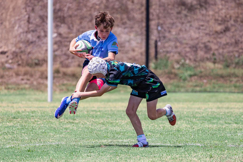 A junior rugby player tackling the ball carrier at Viking Cup 2026