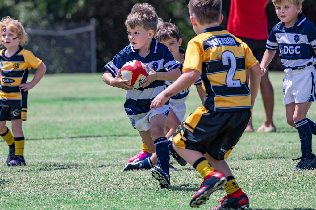 A young rugby player carrying the ball during Viking Cup 2026